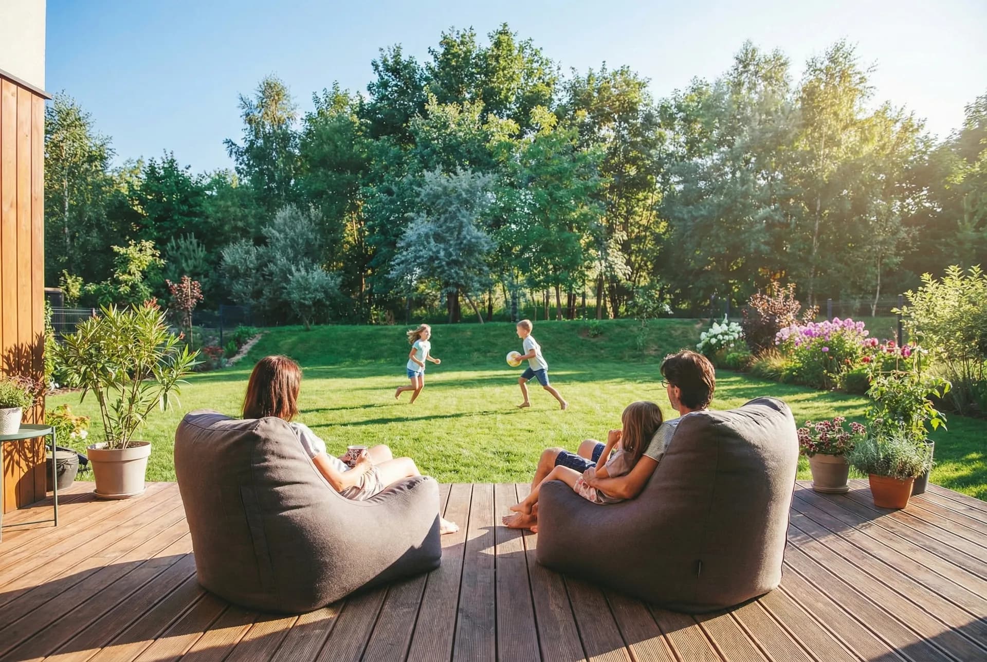 Family relaxing in the yard of a protected home